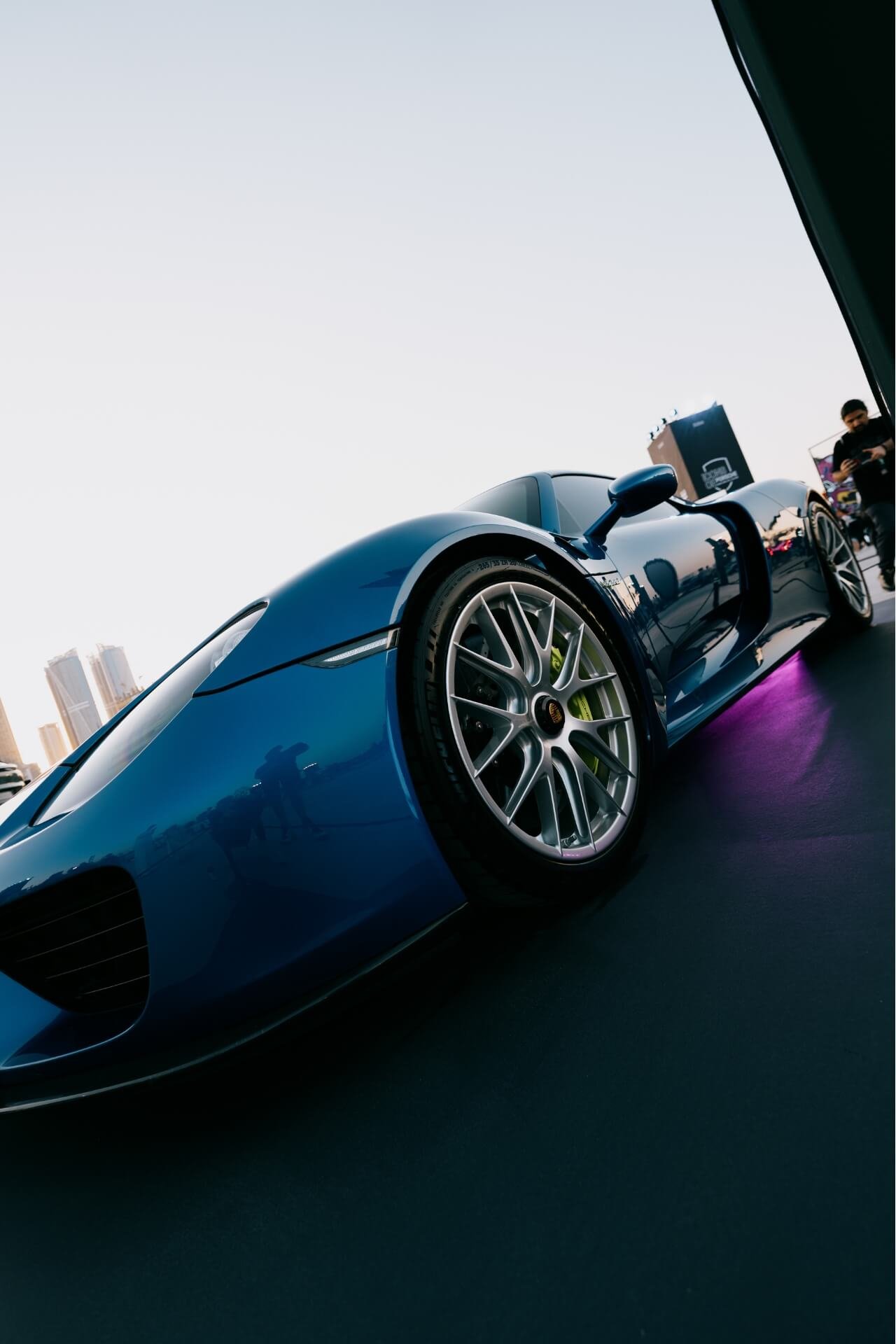 Wide down front angle of a blue Porsche Spyder at Icons of Porsche Dubai 2025