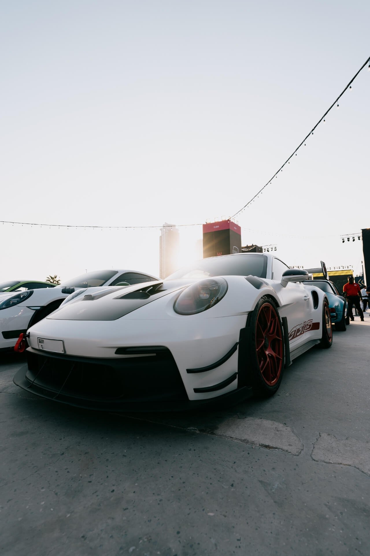 White on red wheels Porsche GT3RS at Icons of Porsche Dubai