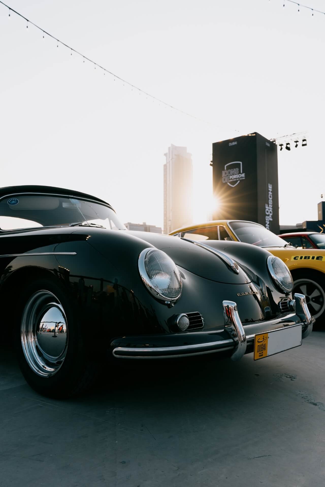 Old Porsche car in black color within Icons of Porsche festival