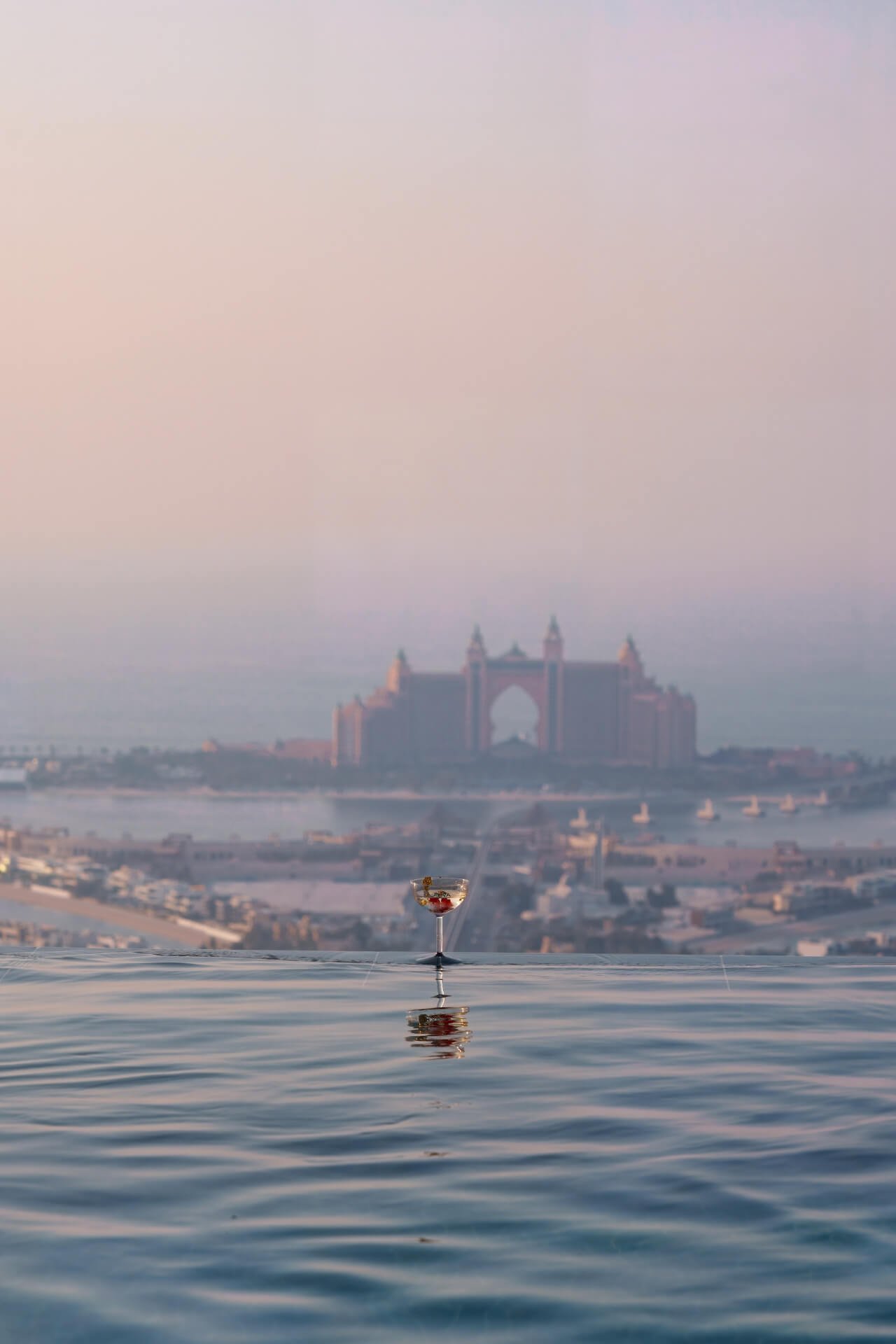 Cocktail on the side of swimming pool at Aura with Atlantis view