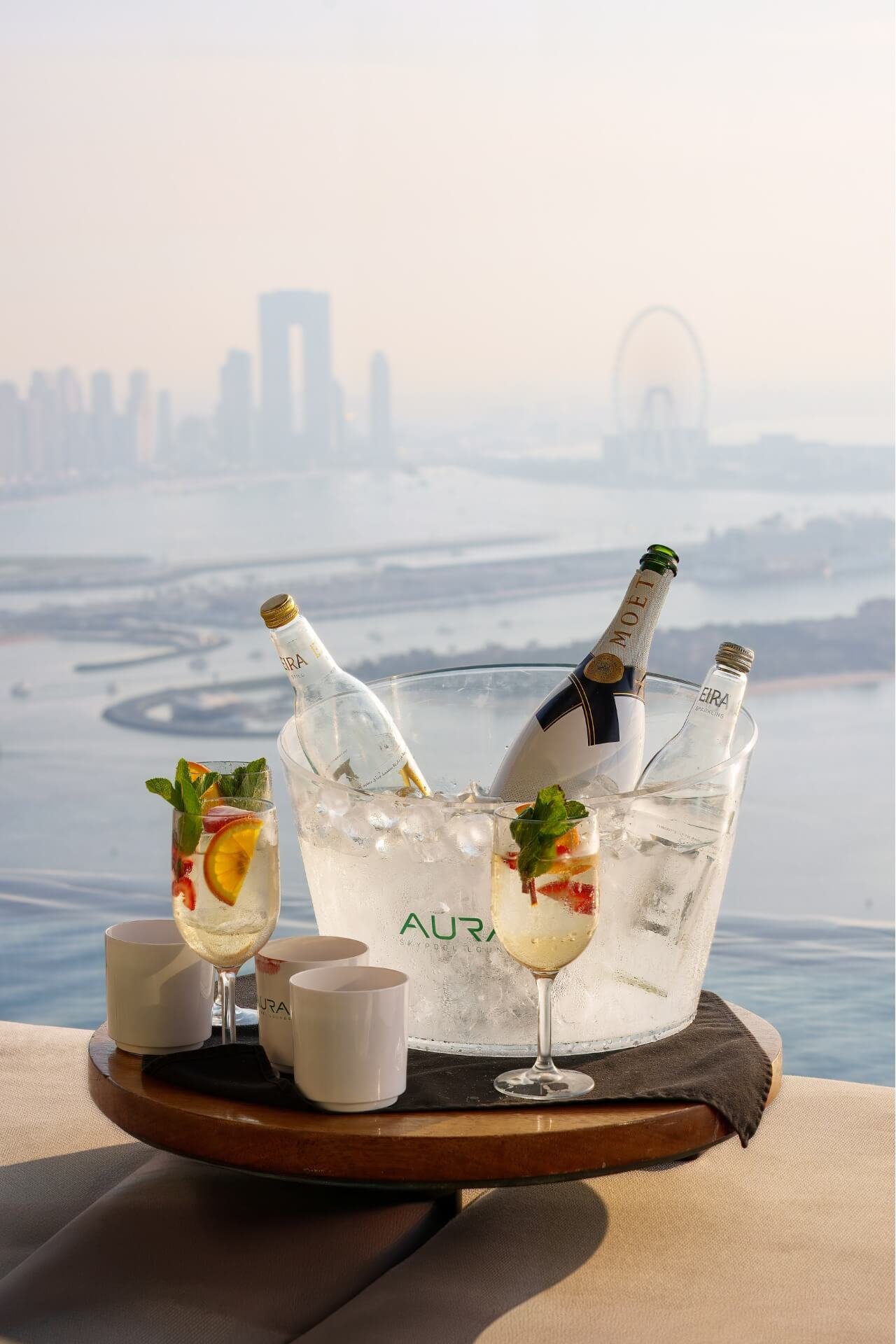 Bucket of Moet champagne on table at Aura Skypool