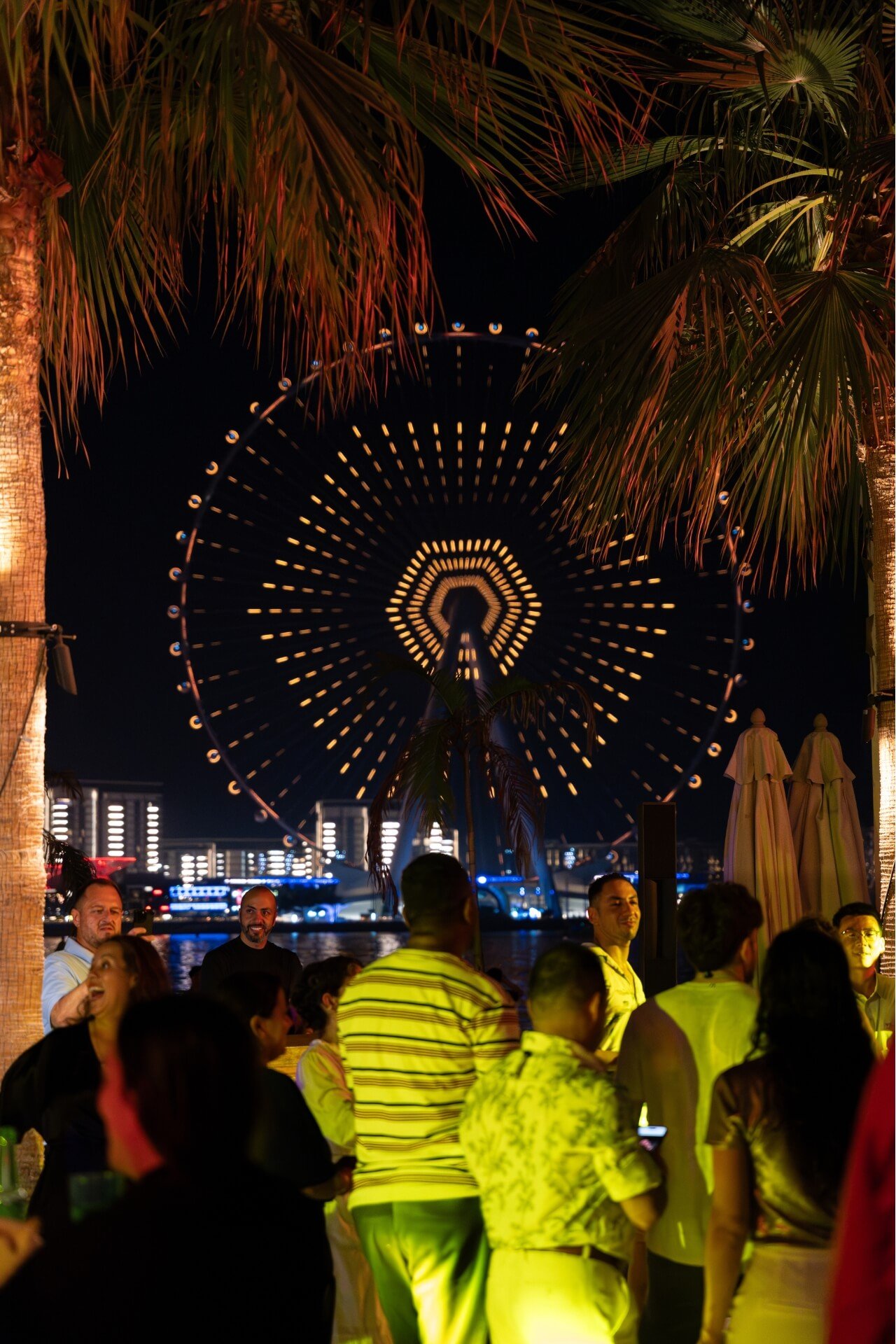 Night party event at Azure Beach with Al Ain wheel in the back
