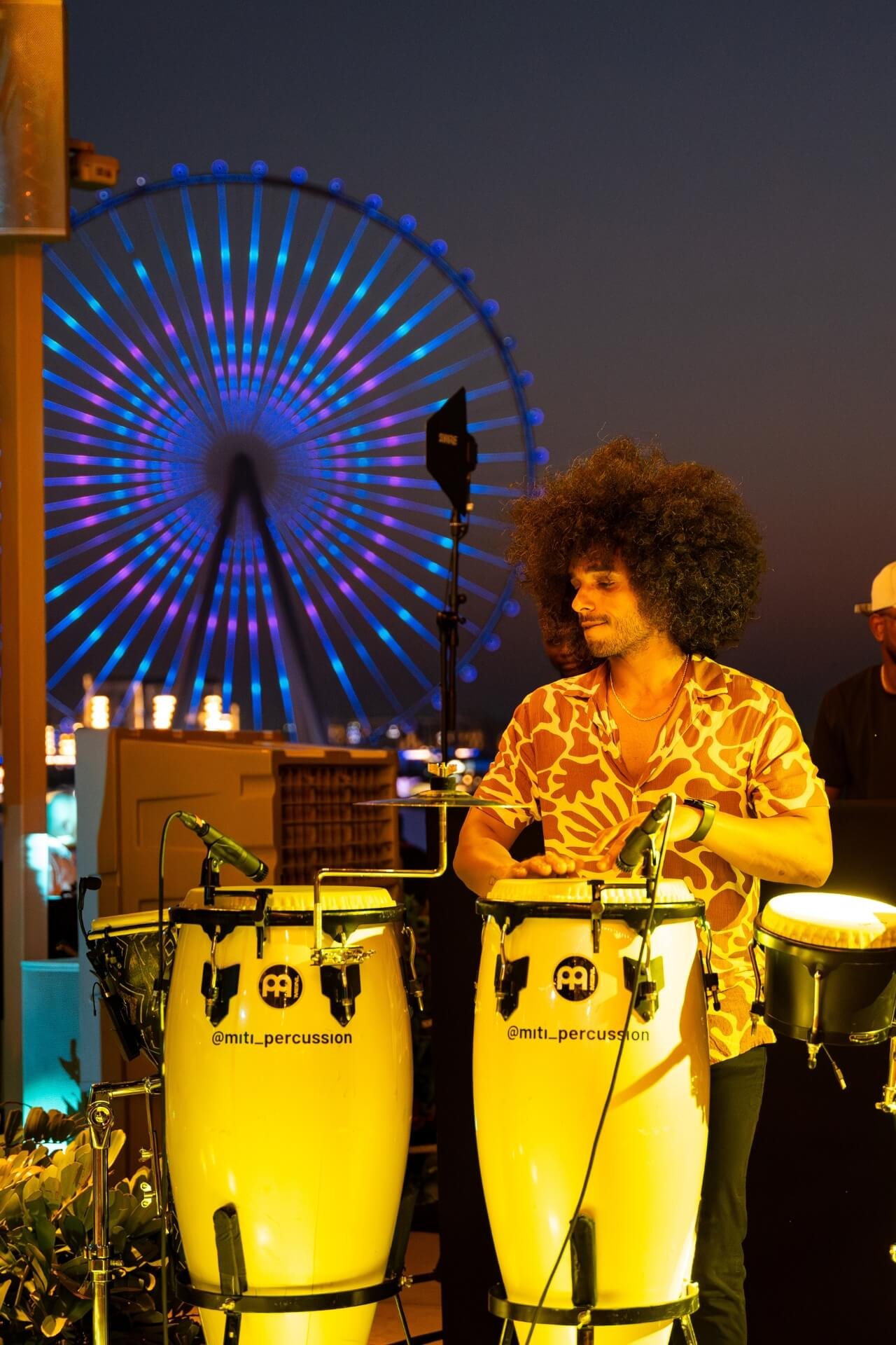 Percussionist during night event at Azure Beach