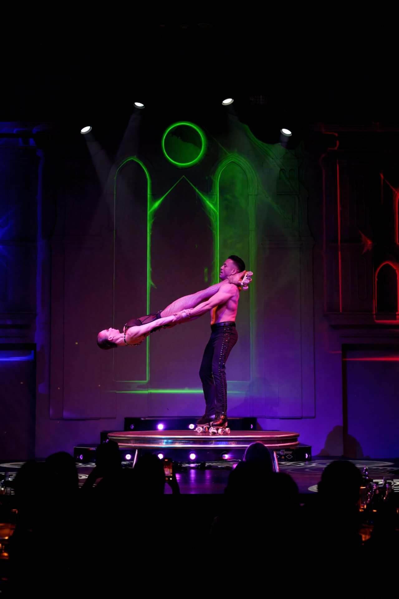 Acrobats on wheels spinning Dream restaurant