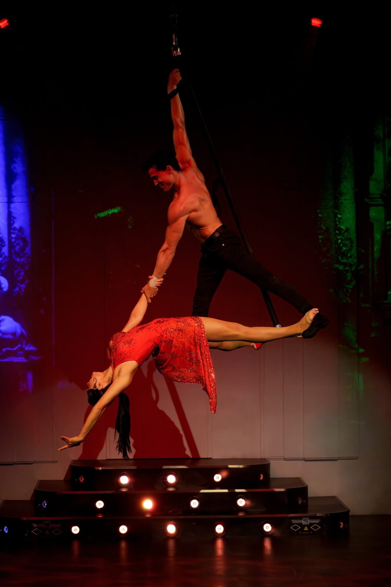 Acrobats hanging up in air Dream restaurant