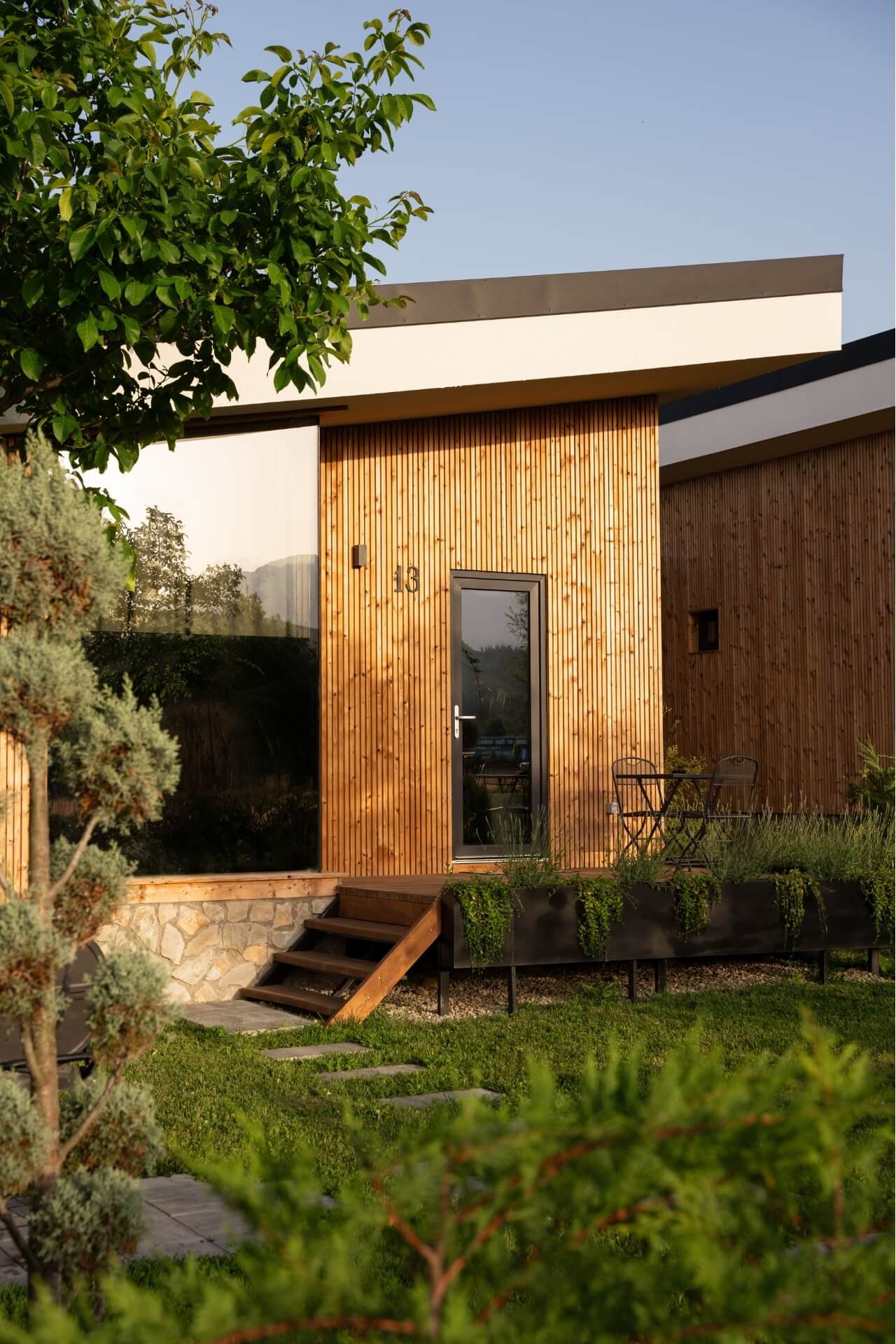 Villa back view with garden at Green Resort Bran