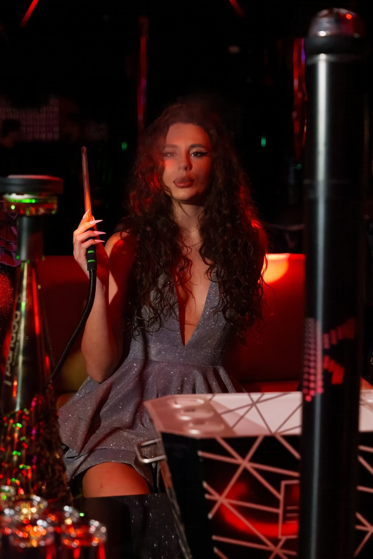 Girl smoking shisha at Epik Club in Dubai