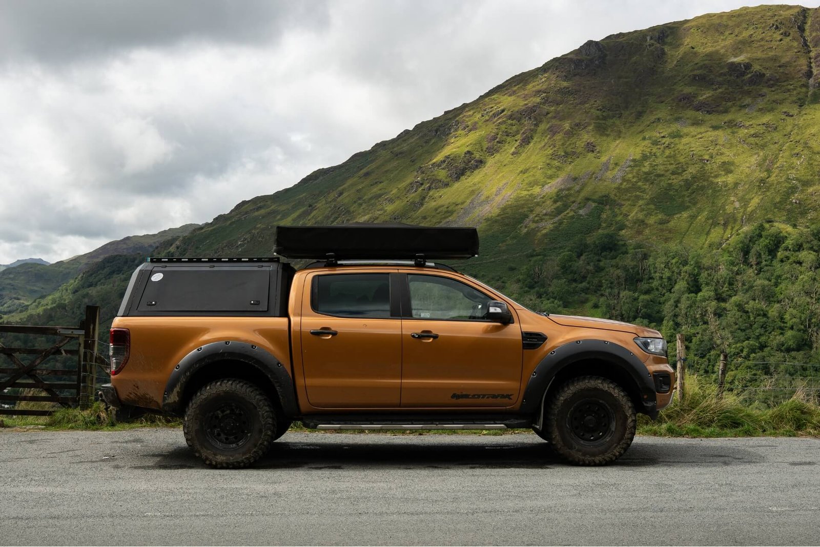 Ford Ranger with Tentbox tent closed on top on a mountain road