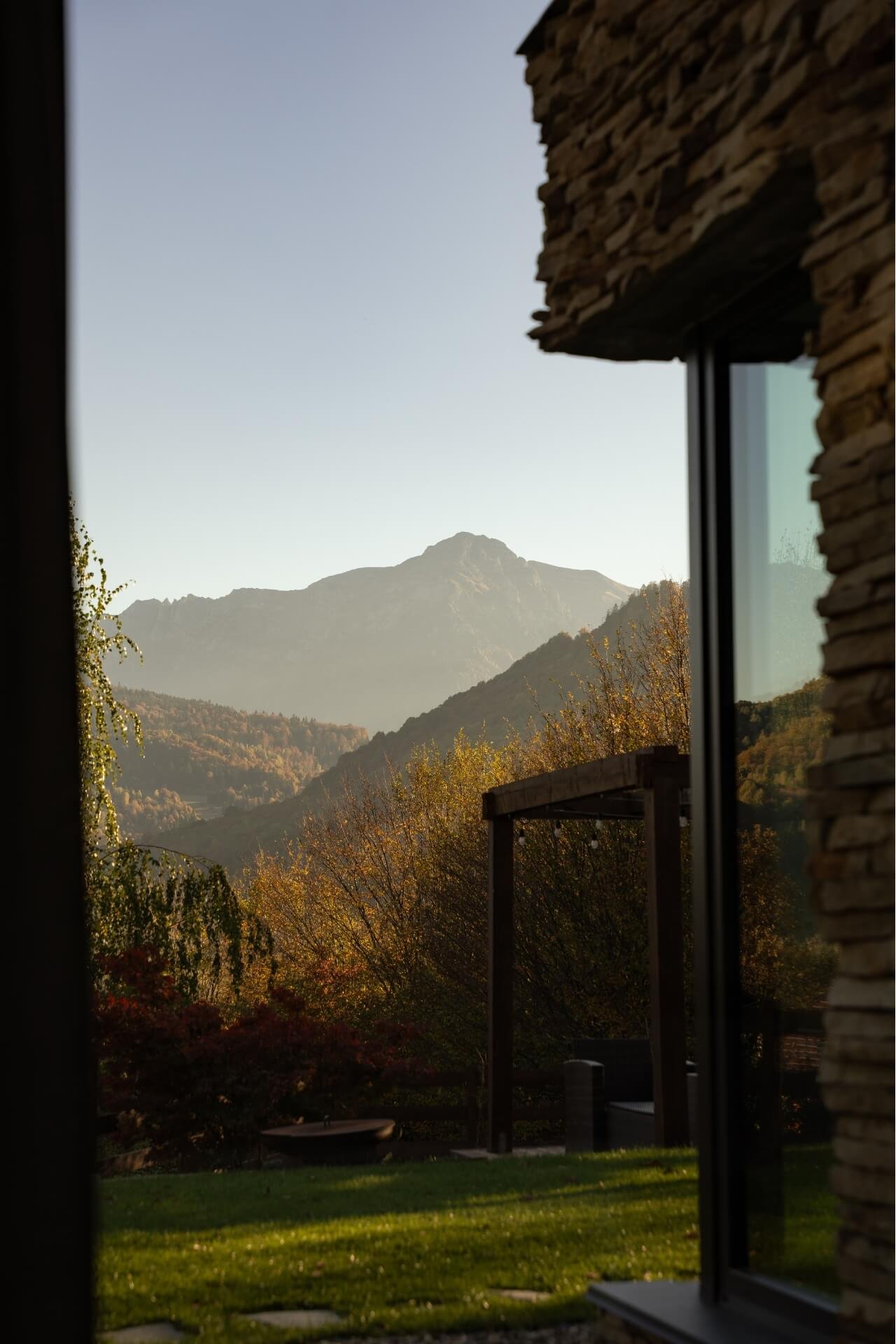 Interior shot from a villa with view on the window to the Carpathian mountains