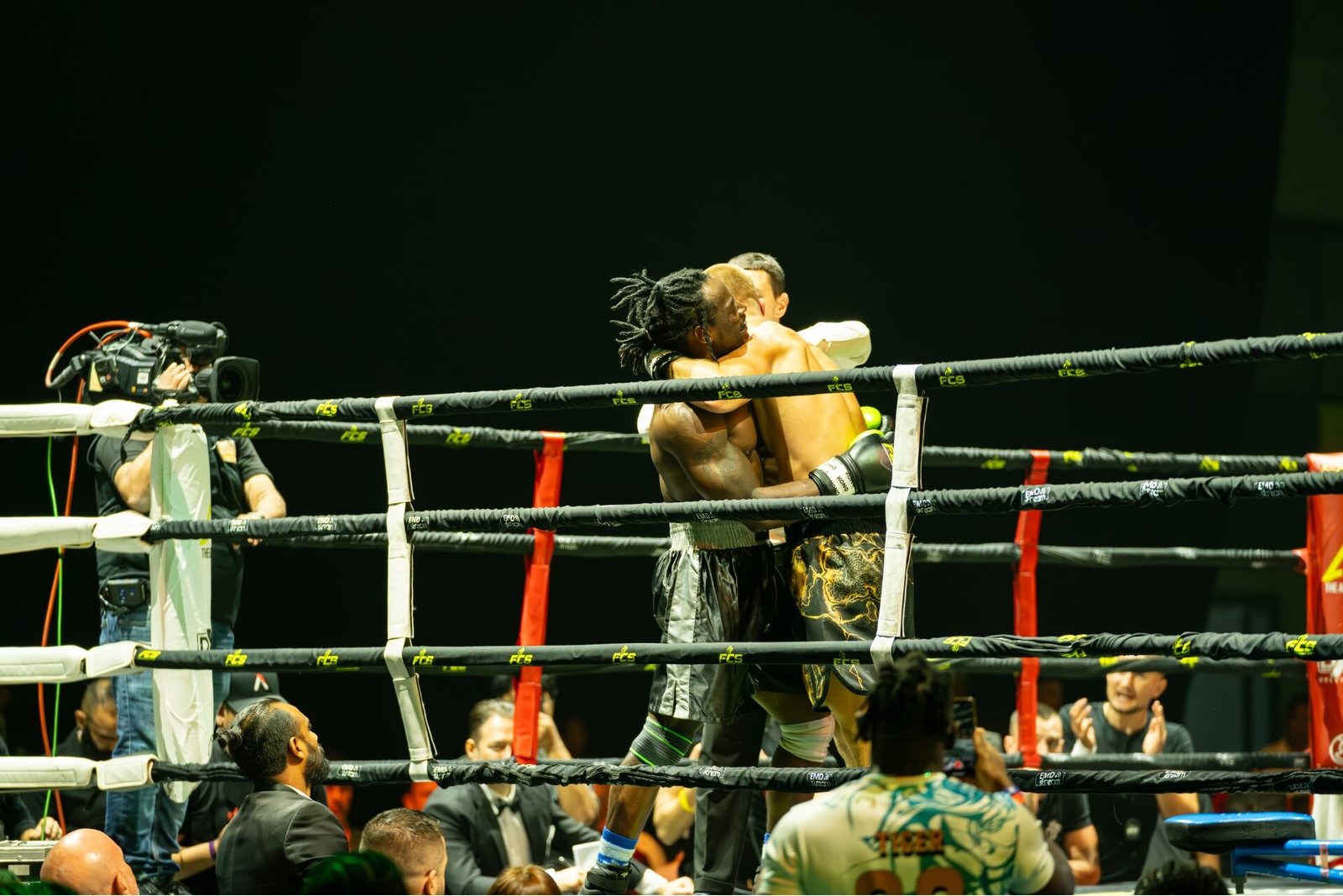 Two men fighting in the boxing ring of The Agenda arena Dubai